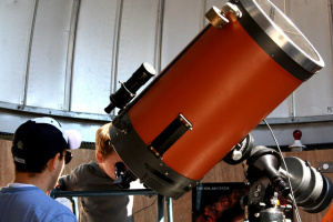 NH Observatory Manager Ian Cohen safely shows a young observer the Sun through the Observatory’s main telescope, a 14-inch reflector. Credit: Loni Anderson/NEFAF